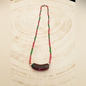 Plastic beads necklace.